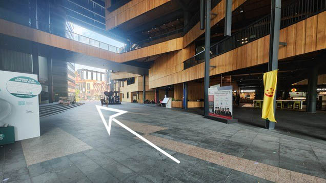 Turn left and walk towards the traffic light