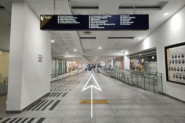 Walk down the ramp and continue straight