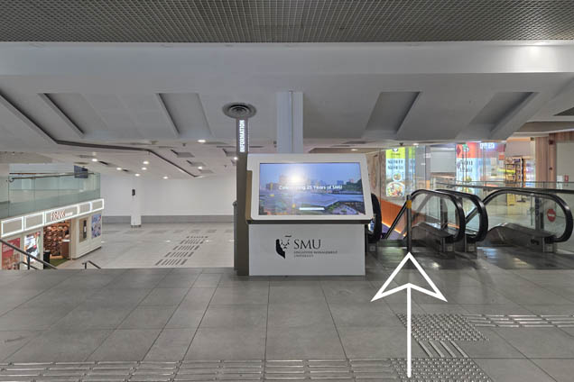 Take the escalator down and turn left past FRANK by OCBC