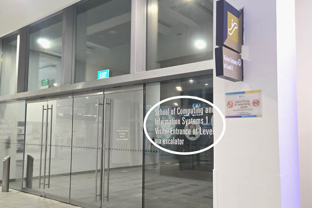 Exit through the glass doors, turn right, and go up the escalator