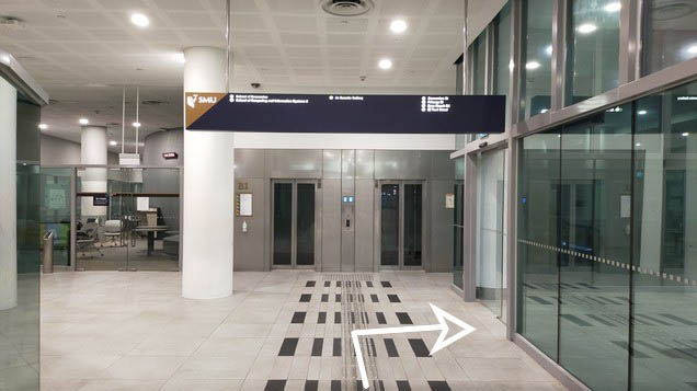 Turn right before the lifts and take the escalator up