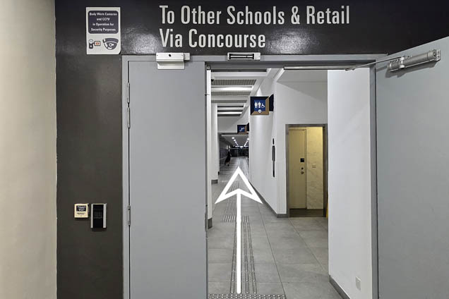 Exit the door To Other Schools &amp; Retail Via Concourse and walk straight