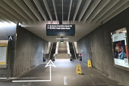Escalator from Bras Basah Station Exit A to street level