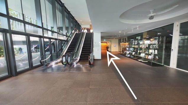 2. Walk towards the awards cabinet and continue straight