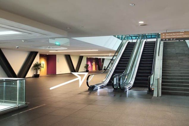 2.3. Keep left and walk past the escalator