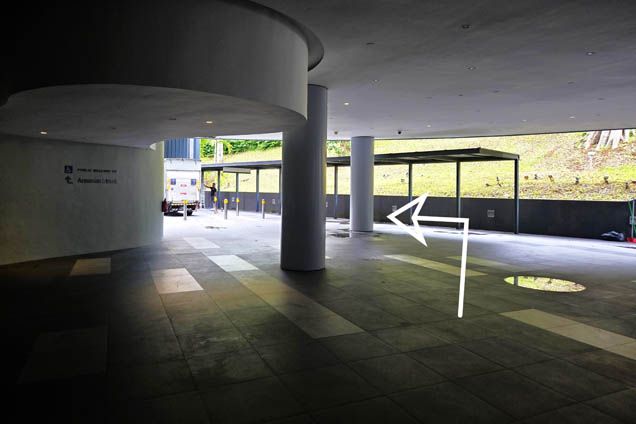 7. Walk past the pillars and walk along the sheltered walkway