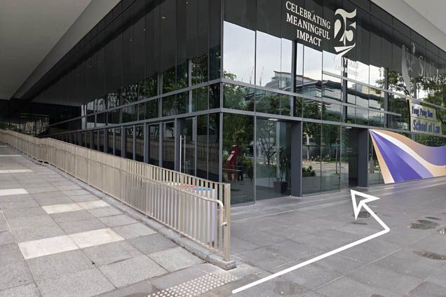 7. At the bottom of the ramp, turn left and enter Yong Pung How School of Law